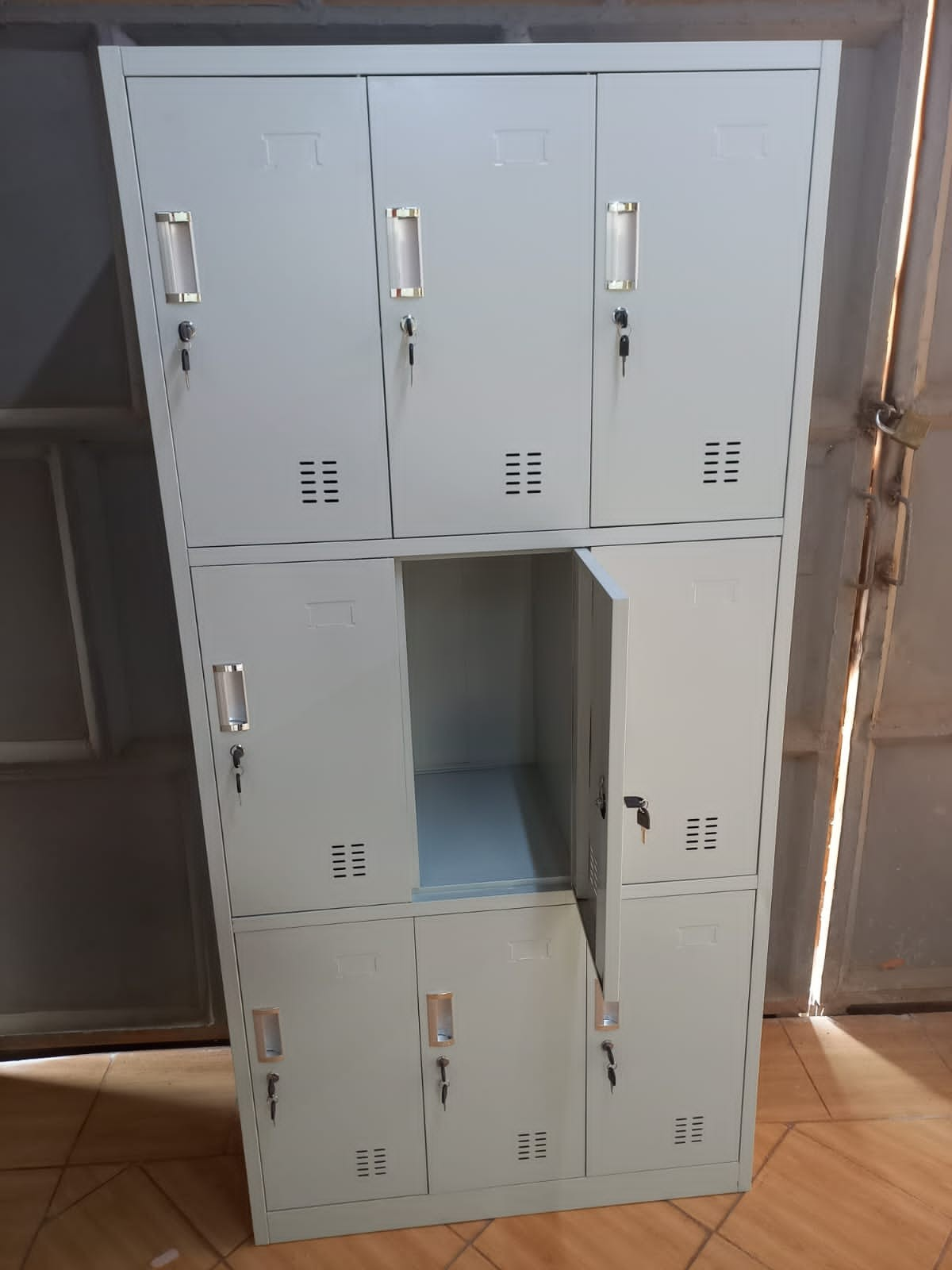 9 locker storage cabinet, nine door steel locker, metal employee lockers, multi compartment storage, staff room lockers, school corridor lockers, secure gym locker, industrial storage cabinet, heavy duty metal locker, 3x3 locker unit, commercial steel locker, locker cabinet with keys, combination lock storage, ventilated metal lockers, office staff storage, factory change room locker, public storage lockers, workplace personal locker, durable steel cabinet, grey metal 9 door locker, blueprint storage cabinet, school gym lockers, spa changing room lockers, fitness center storage, police station gear locker, team locker room furniture, digital lock locker cabinet, padlocking storage locker, name card slot locker, reinforced steel locker, institutional storage cabinet, hospital staff locker, university student locker, library personal storage, co-working space lockers, smart locker cabinet, sleek office locker, space-saving multi locker, vertical tier storage, wall anchor locker cabinet, rust resistant metal locker, powder coated steel locker, garage tool locker, mudroom locker storage, kids playroom toy locker, boutique staff locker, retail employee storage, parcel delivery locker, secure document locker, clean room storage, laboratory locker cabinet, commercial grade locker, BIFMA certified steel furniture, wholesale metal lockers, bulk school storage, affordable locker units, premium employee lockers, heavy load capacity storage, organized staff room, secure valuables locker, phone and wallet locker, express storage cabinet, modular locker system, freestanding metal locker, low maintenance storage, scratch resistant cabinet, quiet close locker doors, interior coat hook locker, multi tier storage solution, space optimizing locker