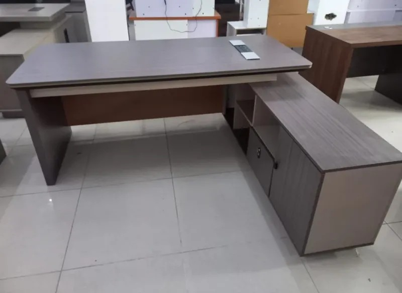 Luxury Workspace for Modern Professionals Transform your office with the 1.8 Meters Imported Executive Office Desk, a premium workstation designed for executives, managers, and professionals who require a spacious, stylish, and highly functional workspace. With its generous 180cm desktop surface, this executive desk provides ample room for computers, documents, office accessories, and daily business activities while creating an impressive professional atmosphere. Moreover, this imported executive desk combines elegant design with superior craftsmanship to enhance modern office interiors. Its large working surface allows better organization and productivity, while the refined finish adds a sophisticated touch to executive offices, boardrooms, and corporate workspaces. The deskβs practical layout supports efficient workflow while maintaining a clean and professional appearance. Additionally, the 1.8 Meters Imported Executive Office Desk features a durable construction designed for long-term office use. Its premium materials, stable structure, and executive styling make it an excellent choice for businesses seeking high-quality office furniture that delivers both performance and visual appeal. β¨ Key Features π₯οΈ Spacious 1.8 Meter Desktop Provides an expansive working area for multiple monitors, laptops, documents, and essential office equipment. πΌ Imported Executive Design Features a premium appearance that enhances executive offices, management rooms, and corporate environments. πͺ Durable Premium Construction Built with high-quality materials to ensure strength, stability, and long-lasting daily performance. π Efficient Workspace Organization Offers plenty of room to arrange office essentials while maintaining a neat and productive workspace. β¨ Elegant Professional Finish Adds a luxurious and modern look that complements high-end office interiors. π’ Ideal for Executive Offices Perfect for company directors, managers, business owners, and professionals requiring a premium workstation. π Large Functional Work Surface Supports comfortable multitasking with enough space for meetings, paperwork, and technology devices. π§Ή Easy Maintenance Design Features a smooth surface that allows convenient cleaning and keeps the desk looking professional. π Product Specifications π₯οΈ Product Type: Imported Executive Office Desk π Size: 1.8 Meters (180cm) ποΈ Material: Premium Office-Grade Wood / Engineered Board (model dependent) π¨ Finish: Luxury Executive Finish π» Suitable For: Computers, Monitors, Documents, Office Accessories & Meetings π’ Applications: Executive Offices, Manager Rooms, Boardrooms, Corporate Workspaces & Home Offices π Why Choose the 1.8 Meters Imported Executive Office Desk? The 1.8 Meters Imported Executive Office Desk offers the ideal combination of luxury, functionality, and durability. Furthermore, its spacious design helps professionals manage daily tasks more efficiently while creating a powerful executive presence. With its premium appearance and practical workspace, this desk is an excellent investment for businesses looking to build a comfortable and impressive office environment.