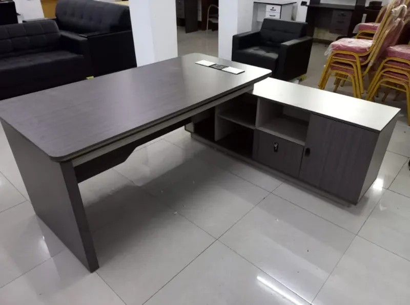 Luxury Workspace for Modern Professionals Transform your office with the 1.8 Meters Imported Executive Office Desk, a premium workstation designed for executives, managers, and professionals who require a spacious, stylish, and highly functional workspace. With its generous 180cm desktop surface, this executive desk provides ample room for computers, documents, office accessories, and daily business activities while creating an impressive professional atmosphere. Moreover, this imported executive desk combines elegant design with superior craftsmanship to enhance modern office interiors. Its large working surface allows better organization and productivity, while the refined finish adds a sophisticated touch to executive offices, boardrooms, and corporate workspaces. The deskβs practical layout supports efficient workflow while maintaining a clean and professional appearance. Additionally, the 1.8 Meters Imported Executive Office Desk features a durable construction designed for long-term office use. Its premium materials, stable structure, and executive styling make it an excellent choice for businesses seeking high-quality office furniture that delivers both performance and visual appeal. β¨ Key Features π₯οΈ Spacious 1.8 Meter Desktop Provides an expansive working area for multiple monitors, laptops, documents, and essential office equipment. πΌ Imported Executive Design Features a premium appearance that enhances executive offices, management rooms, and corporate environments. πͺ Durable Premium Construction Built with high-quality materials to ensure strength, stability, and long-lasting daily performance. π Efficient Workspace Organization Offers plenty of room to arrange office essentials while maintaining a neat and productive workspace. β¨ Elegant Professional Finish Adds a luxurious and modern look that complements high-end office interiors. π’ Ideal for Executive Offices Perfect for company directors, managers, business owners, and professionals requiring a premium workstation. π Large Functional Work Surface Supports comfortable multitasking with enough space for meetings, paperwork, and technology devices. π§Ή Easy Maintenance Design Features a smooth surface that allows convenient cleaning and keeps the desk looking professional. π Product Specifications π₯οΈ Product Type: Imported Executive Office Desk π Size: 1.8 Meters (180cm) ποΈ Material: Premium Office-Grade Wood / Engineered Board (model dependent) π¨ Finish: Luxury Executive Finish π» Suitable For: Computers, Monitors, Documents, Office Accessories & Meetings π’ Applications: Executive Offices, Manager Rooms, Boardrooms, Corporate Workspaces & Home Offices π Why Choose the 1.8 Meters Imported Executive Office Desk? The 1.8 Meters Imported Executive Office Desk offers the ideal combination of luxury, functionality, and durability. Furthermore, its spacious design helps professionals manage daily tasks more efficiently while creating a powerful executive presence. With its premium appearance and practical workspace, this desk is an excellent investment for businesses looking to build a comfortable and impressive office environment.